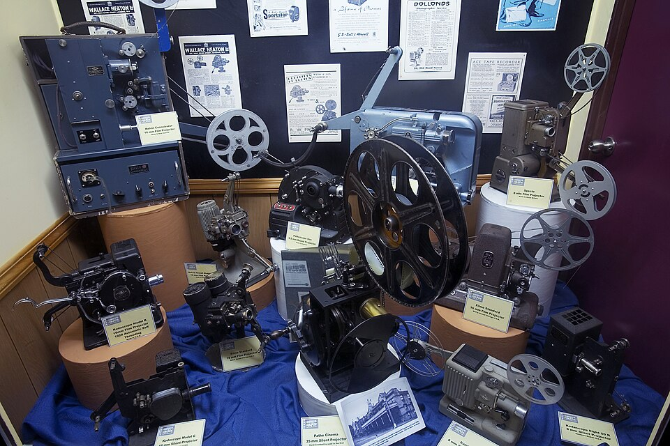 A display full of vintage film projectors and film memorabilia
